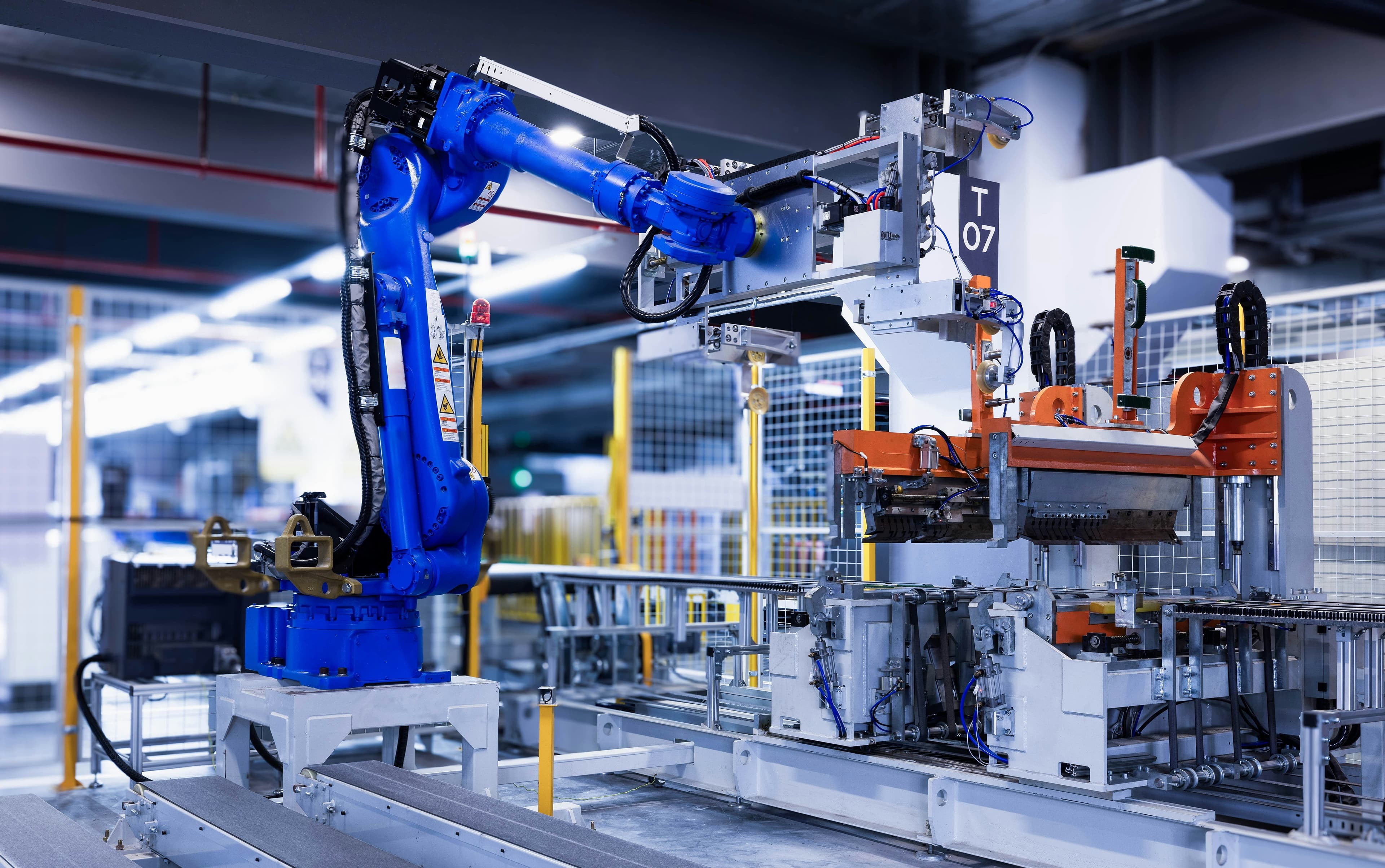An industrial robot arm on a modern production line